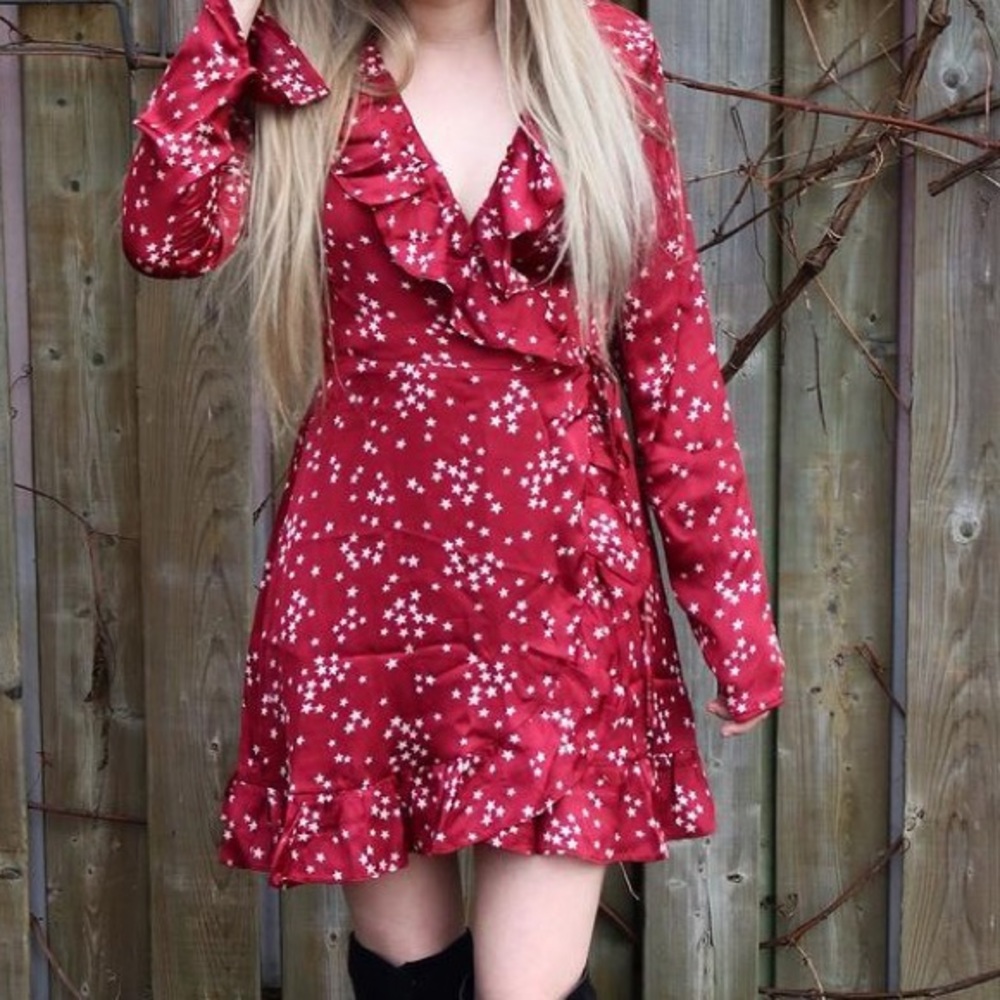 Silk red mini wrap dress with white stars.